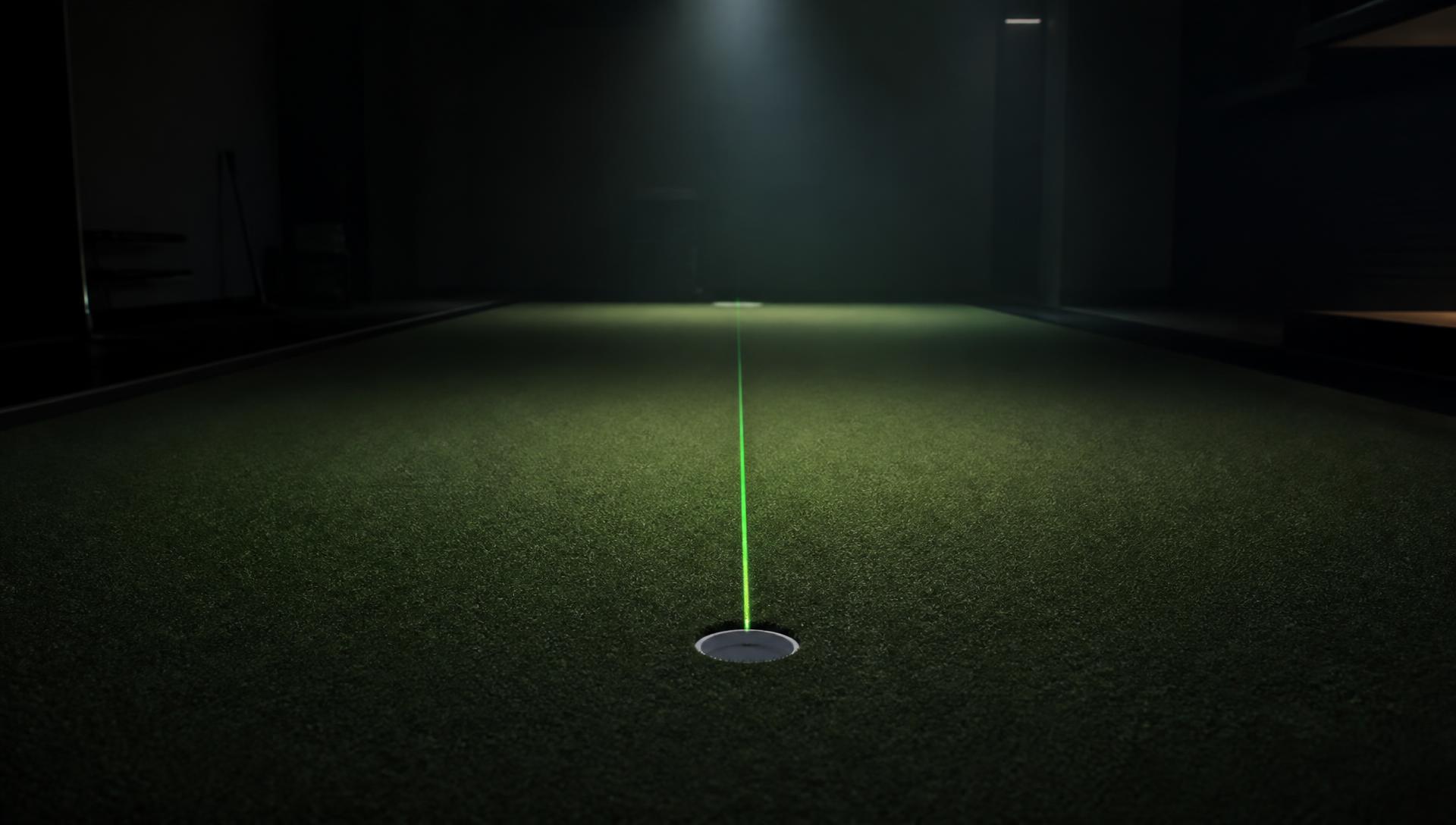 Ball and target line on a dark indoor putting green
